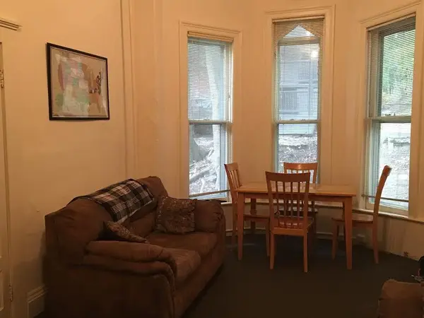 Large high ceiling and windows 1 bed apartment with a study